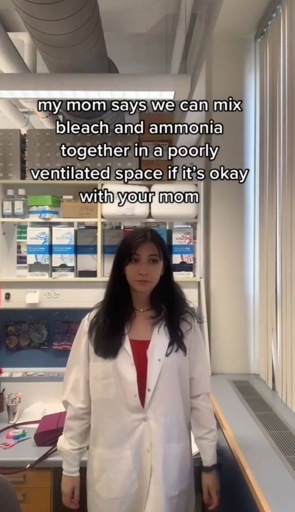 Woman wearing a labcoat, standing and looking blankly past the camera, with the caption, “my mom says we can mix bleach and ammonia together in a poorly ventilated space if it's okay with your mom”