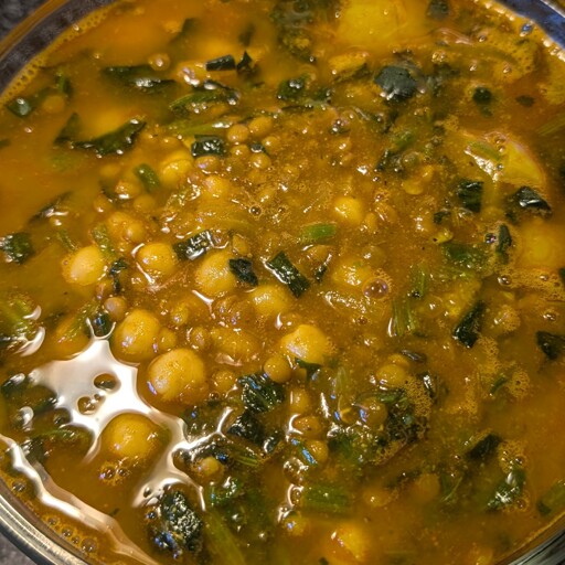 photo of soup with chickpeas, lentils, and spinach.